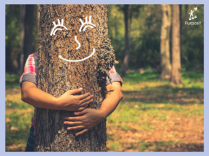Pic of child hugging tree